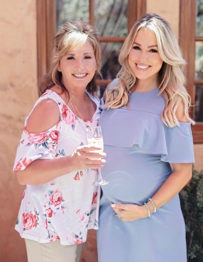 Grandma standing with her pregnant daughter