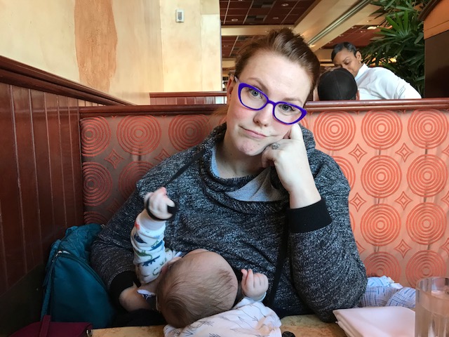 Caitlin and Odin in a restaurant.