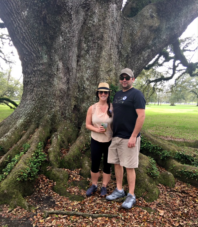 Lynnaya and her husband underneath a tree.
