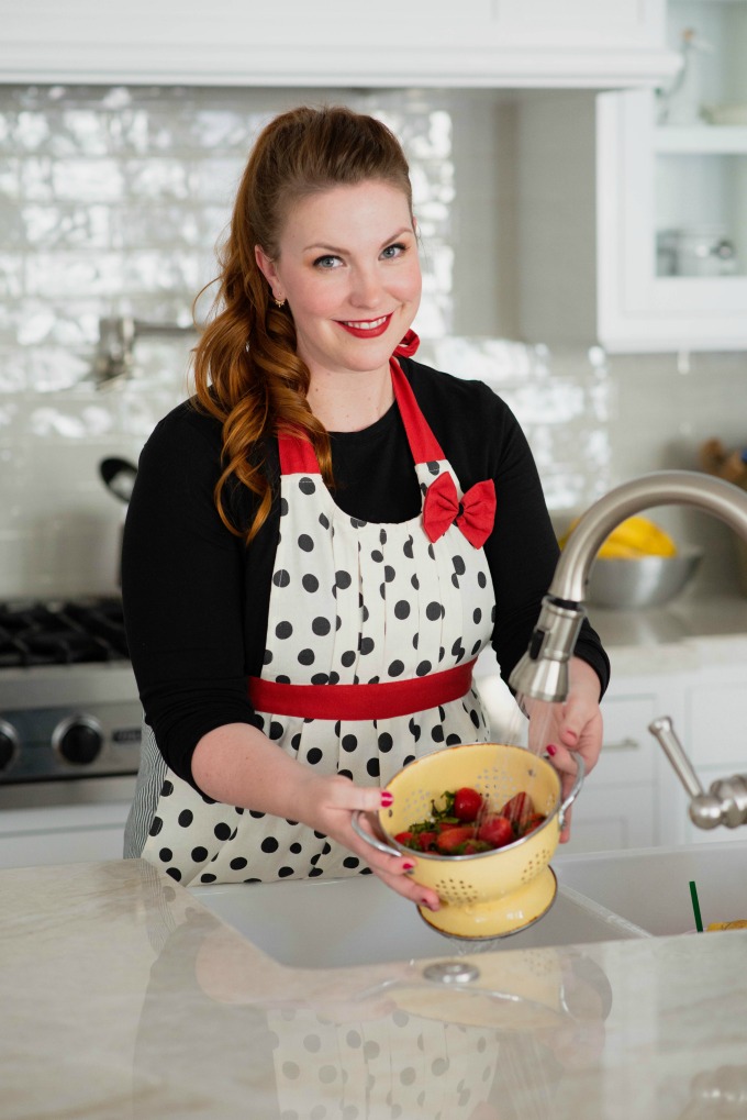 Caitlin washing strawberries