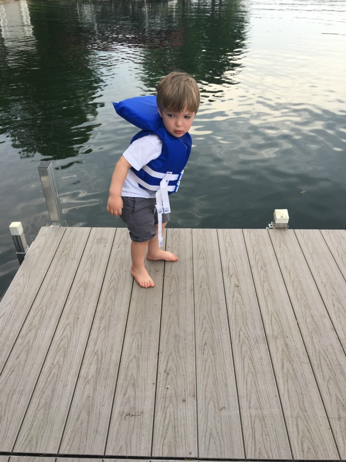 Eli standing on a dock