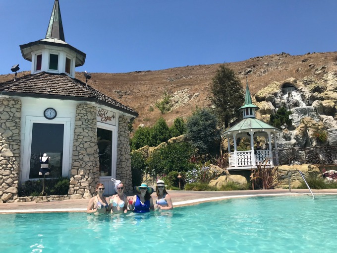 Caitlin with friends in pool