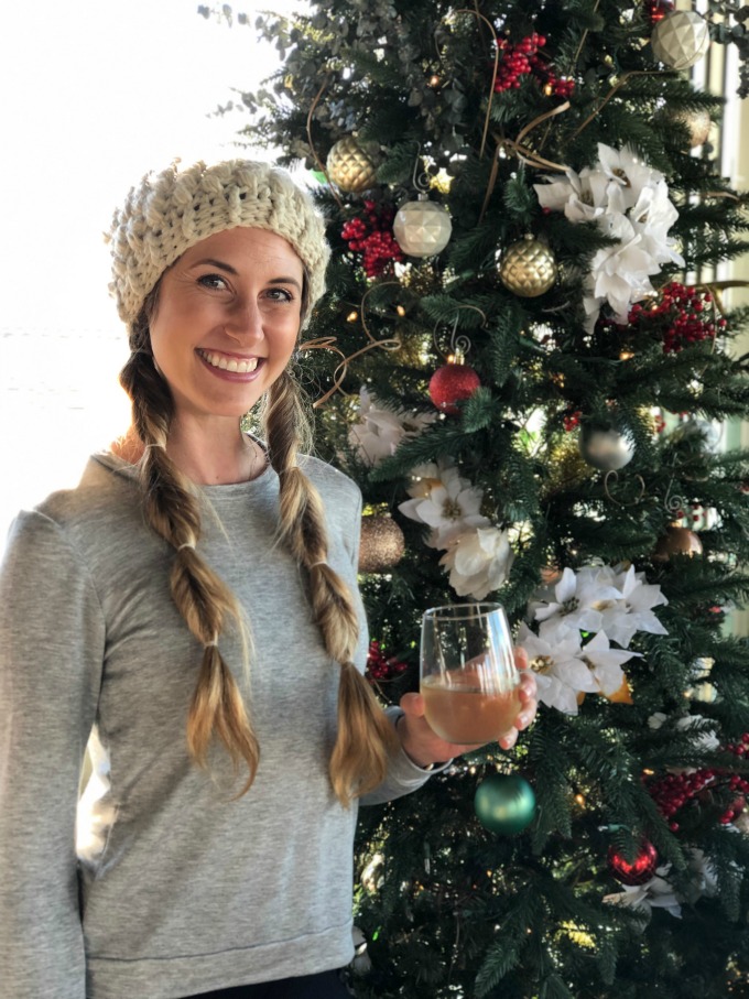 Leann in front of Christmas tree