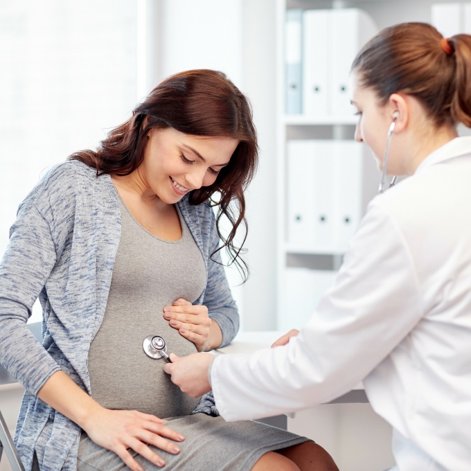 pregnant woman with doctor