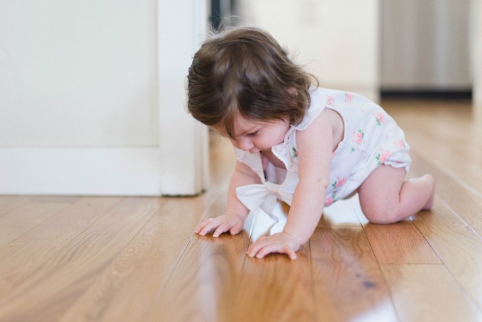 baby crawling on hard wood floor