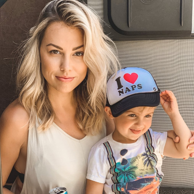 Mom with son wearing an I love naps hat.