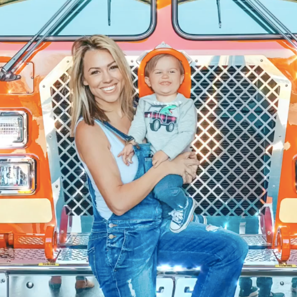 mom and son with a fire truck