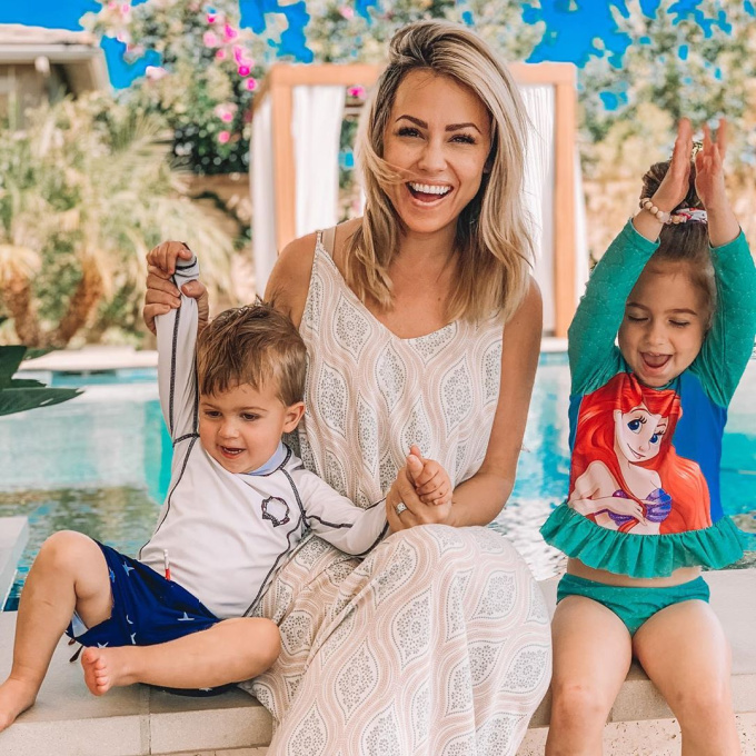 mom and kids by the pool