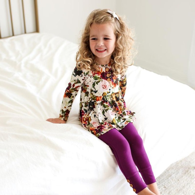 little girl wearing outfit from posh peanut 
