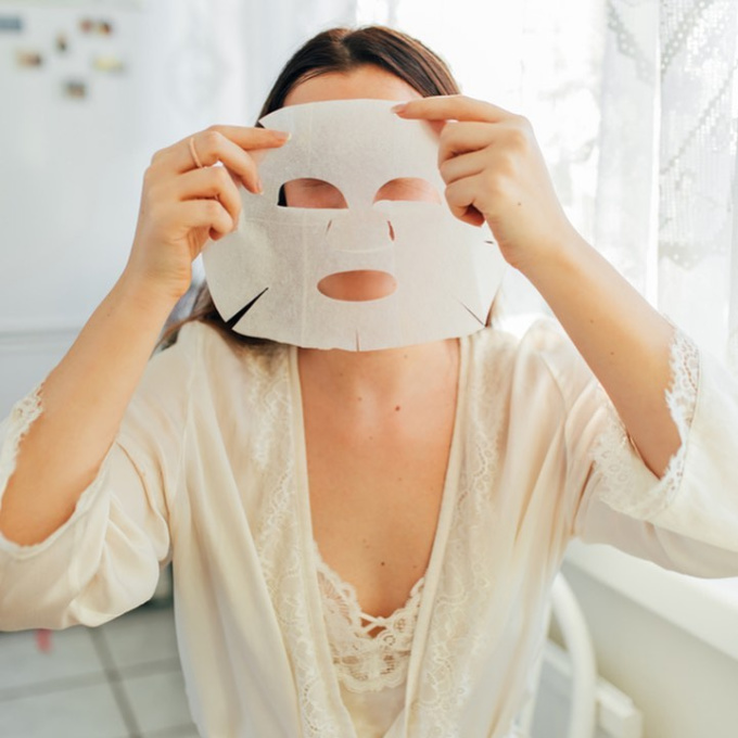 woman holding Aloisia Beauty skincare mask