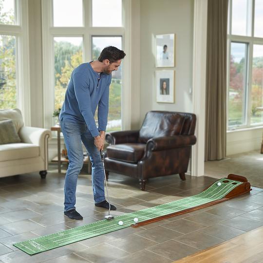 man using Perfect Practice putting mat
