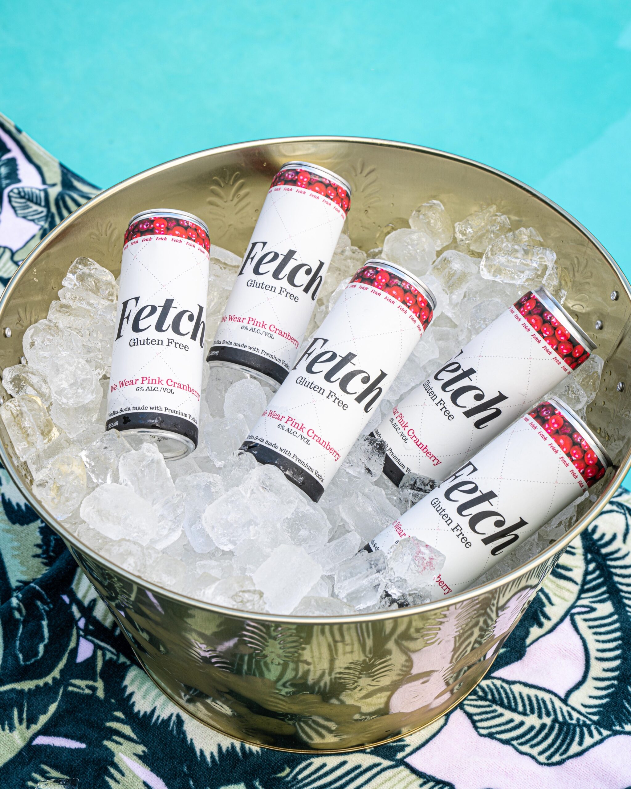 Fetch canned cocktails in a brass ice bucket.