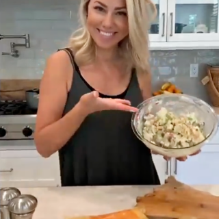 Jessica Hall holding a bowl of vegan potato salad.