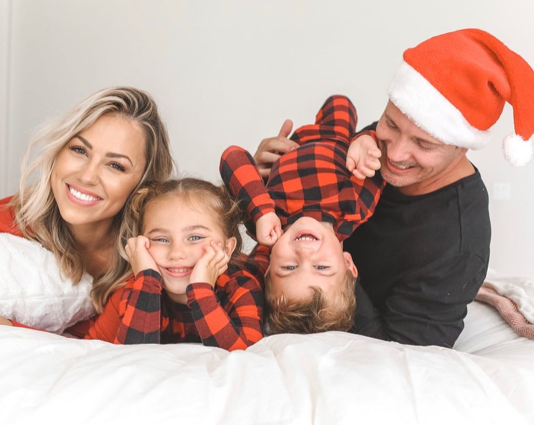 Jessica Hall and family wearing matching Christmas pajamas. 