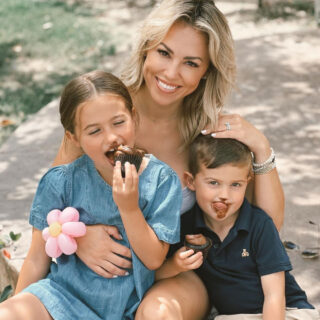 Jessica Hall with her kids eating chocolate cupcakes.