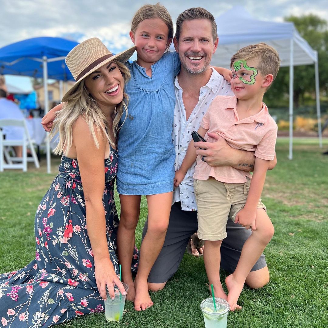 Jessica Hall and family at a festival with face paint.